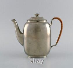 Just Andersen (1884-1943), Denmark. Art Deco tin coffee pot with wicker handle